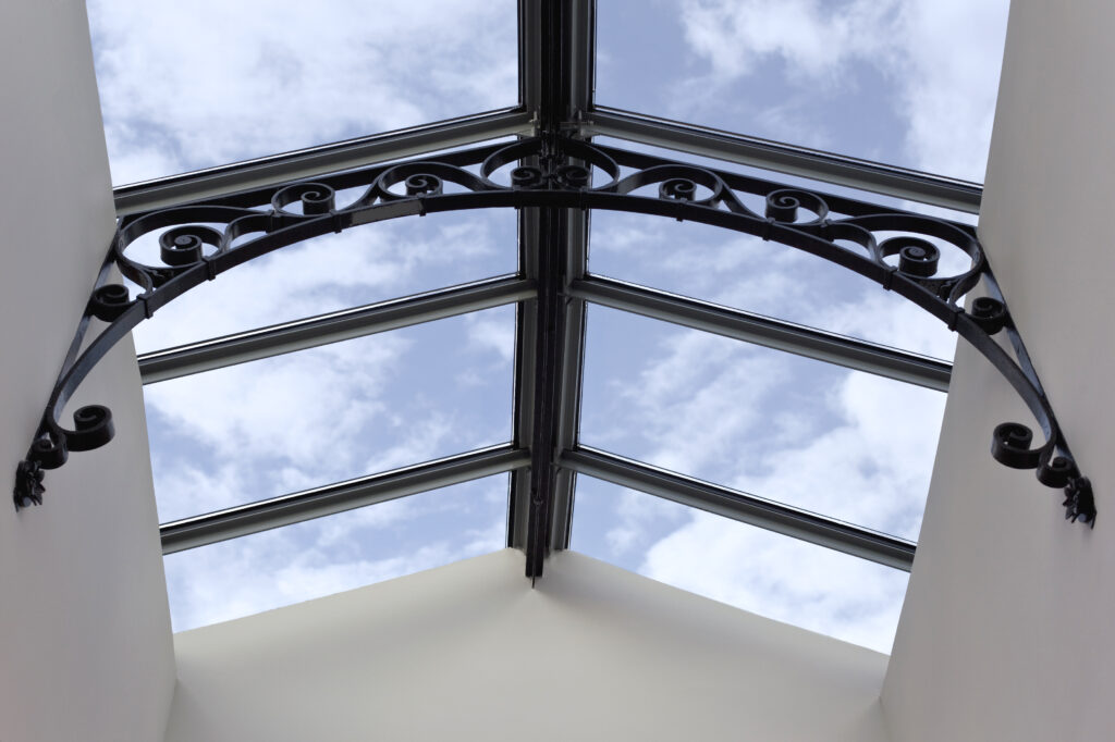 stylish glass roof and blue sky on background